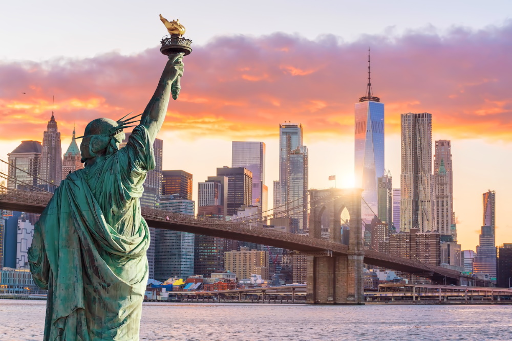 Statue-Liberty-and-New-York-city-skyline-at-sunset